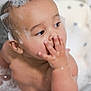 baby, bath, bubbles, soap, child, cute, water, hand, face, skin, head, finger, playful, toddler, bubble_bath, bathroom, sitting, wet, infant, star_pattern