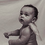Danté is registered to the contest to win money with this photo: angel_wings, arm, baby, background, child, chubby, closeup, curly_hair, cute, expression, hand, infant, innocent, looking_up, monochrome, portrait, skin, small_object, soft_light, studio