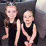 Kayla participe au concours pour gagner de l'argent avec cette photo : baby, barefoot, black_clothing, bracelet, child, children, couch, cute, girl, hair_bun, happy, home, indoor, playing, portrait, seated, siblings, smile, sofa, young