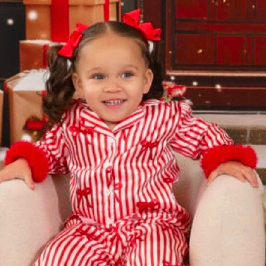 Tierone joined the competition — help win amazing prizes! child, girl, pajamas, red_bows, armchair, christmas_presents, holiday, wreath, smiling, festive, indoor, decorations, winter, snowflakes, cozy, portrait, cute, holiday_season, celebration, happy