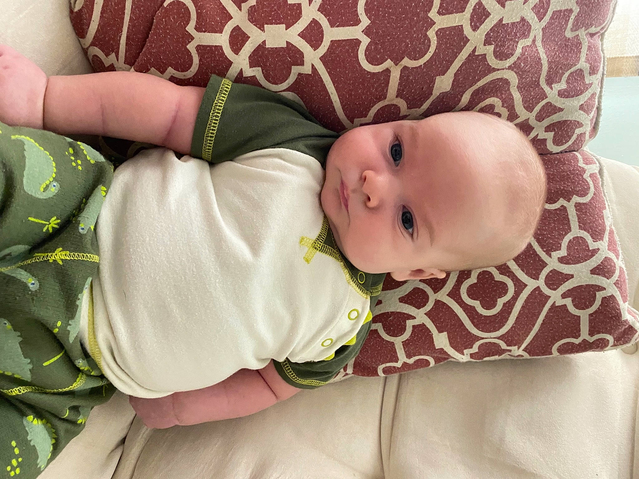 Lyle is registered to the contest to win money with this photo: baby, baby_products, baby_toddler_clothing, bedding, cheek, child, comfort, couch, eye, eyelash, head, human_body, linens, lip, pattern, person, skin, sleeve, textile, toddler