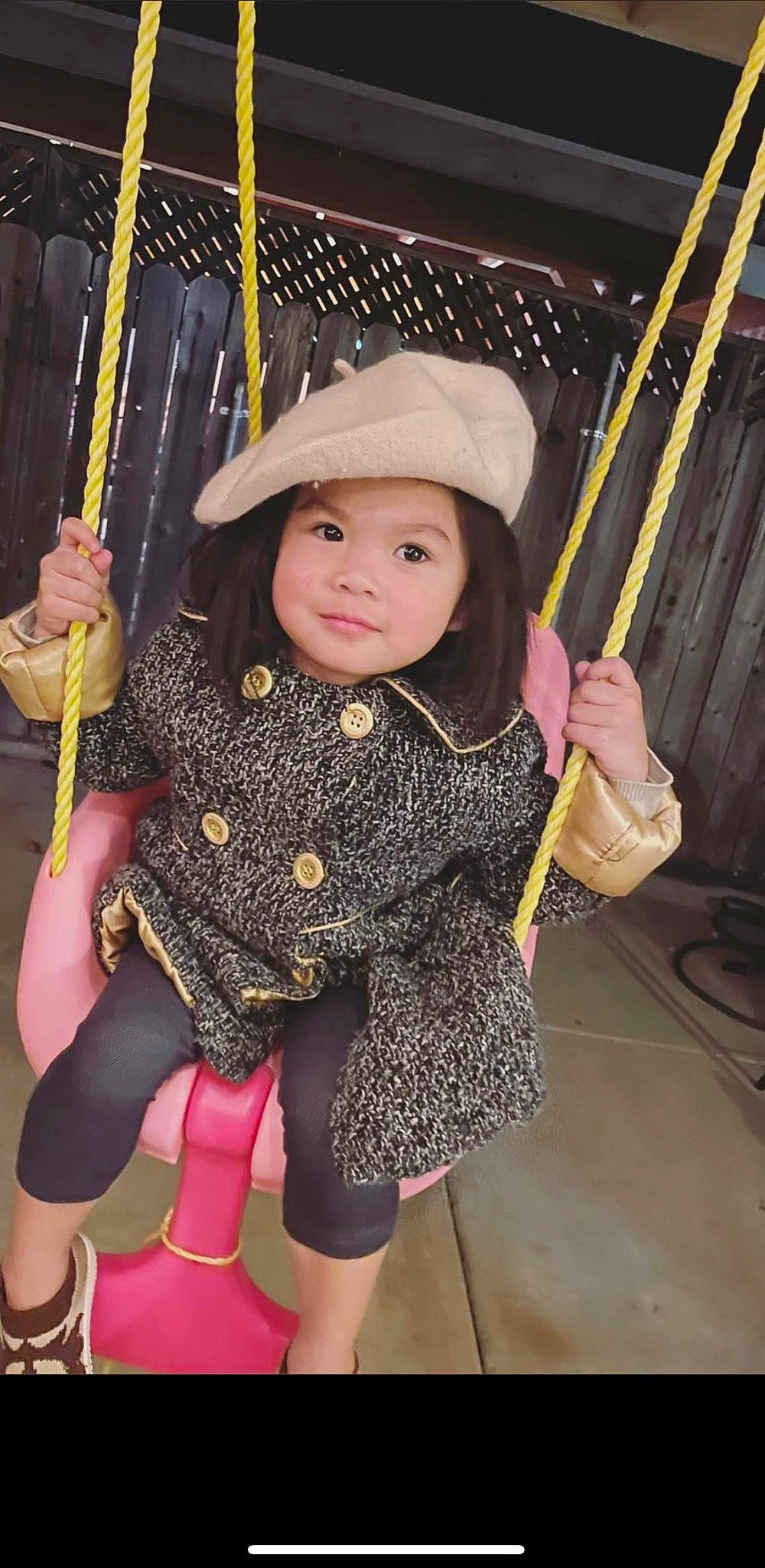 Keziah joined the competition — help win amazing prizes! baby_toddler_clothing, child, city, fashion_accessory, fun, happy, headwear, human_leg, leisure, magenta, pattern, person, pink, playground, recreation, sleeve, standing, sun_hat, swing, textile