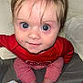 William joined the competition — help win amazing prizes! baby, child, infant, face, eyes, red_clothing, striped_pants, bed, blanket, cute, looking_up, hands, skin, indoors, person, portrait, smiling, young_child, sleepwear, closeup