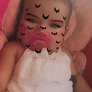Maylynn joined the competition — help win amazing prizes! baby, infant, child, portrait, sleeping, pacifier, white_dress, blanket, pink_blanket, lying_down, face, eyes, hair, bat_filter, halloween, cozy, indoor, close_up, soft_lighting, photography