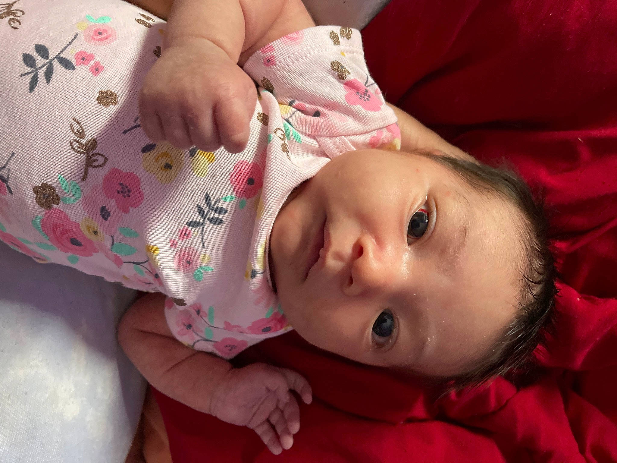 Evalynn is registered to the contest to win money with this photo: baby, baby_toddler_clothing, cheek, child, close_up, comfort, eyelash, glasses, hand, human_body, iris, lip, mouth, neck, nose, pattern, person, pink, skin, sleeve