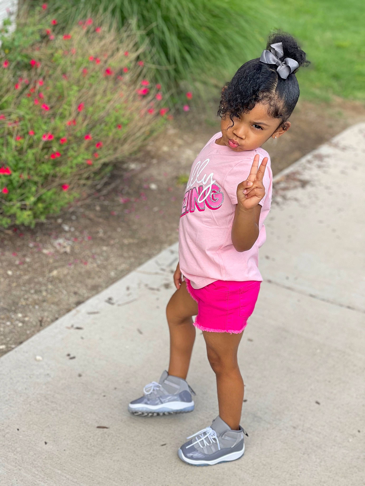 Lovely Michelle is registered to the contest to win money with this photo: asphalt, cool, flower, grass, happy, human_leg, joint, leisure, magenta, person, pink, plant, recreation, road, shoe, shorts, sleeve, sneakers, summer, thigh