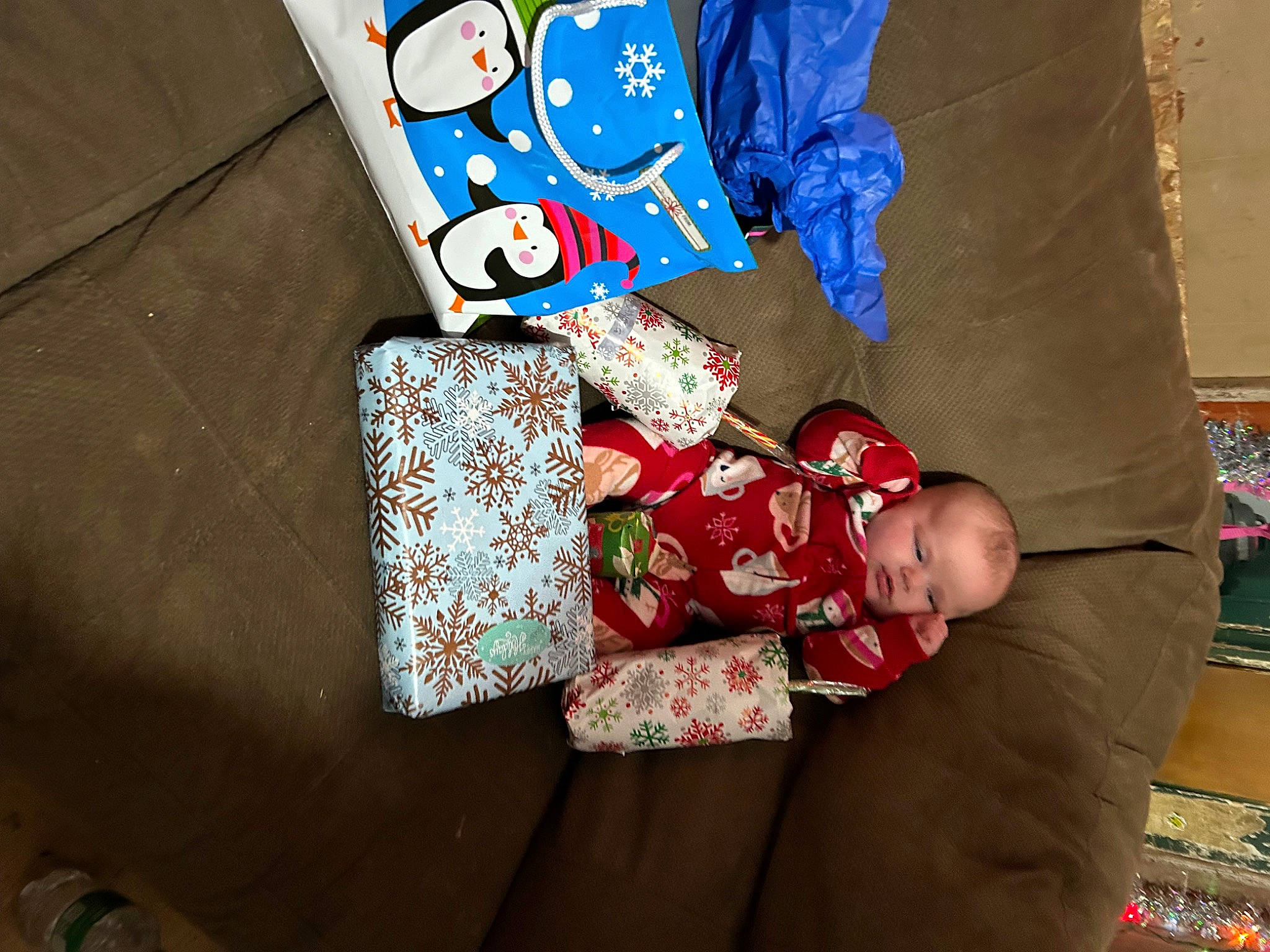 Hazel is registered to the contest to win money with this photo: baby, baby_toddler_clothing, carmine, child, christmas, christmas_eve, comfort, electric_blue, event, happy, holiday, linens, pattern, person, rectangle, room, sleeve, textile, toddler, wood