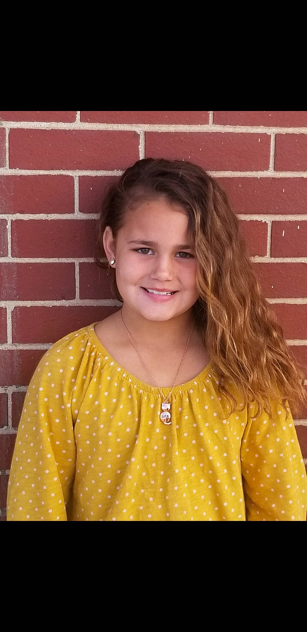 Carlee is registered to the contest to win money with this photo: child, child_model, hair, hairstyle, joy, long_hair, pattern, person, portrait, smile, yellow