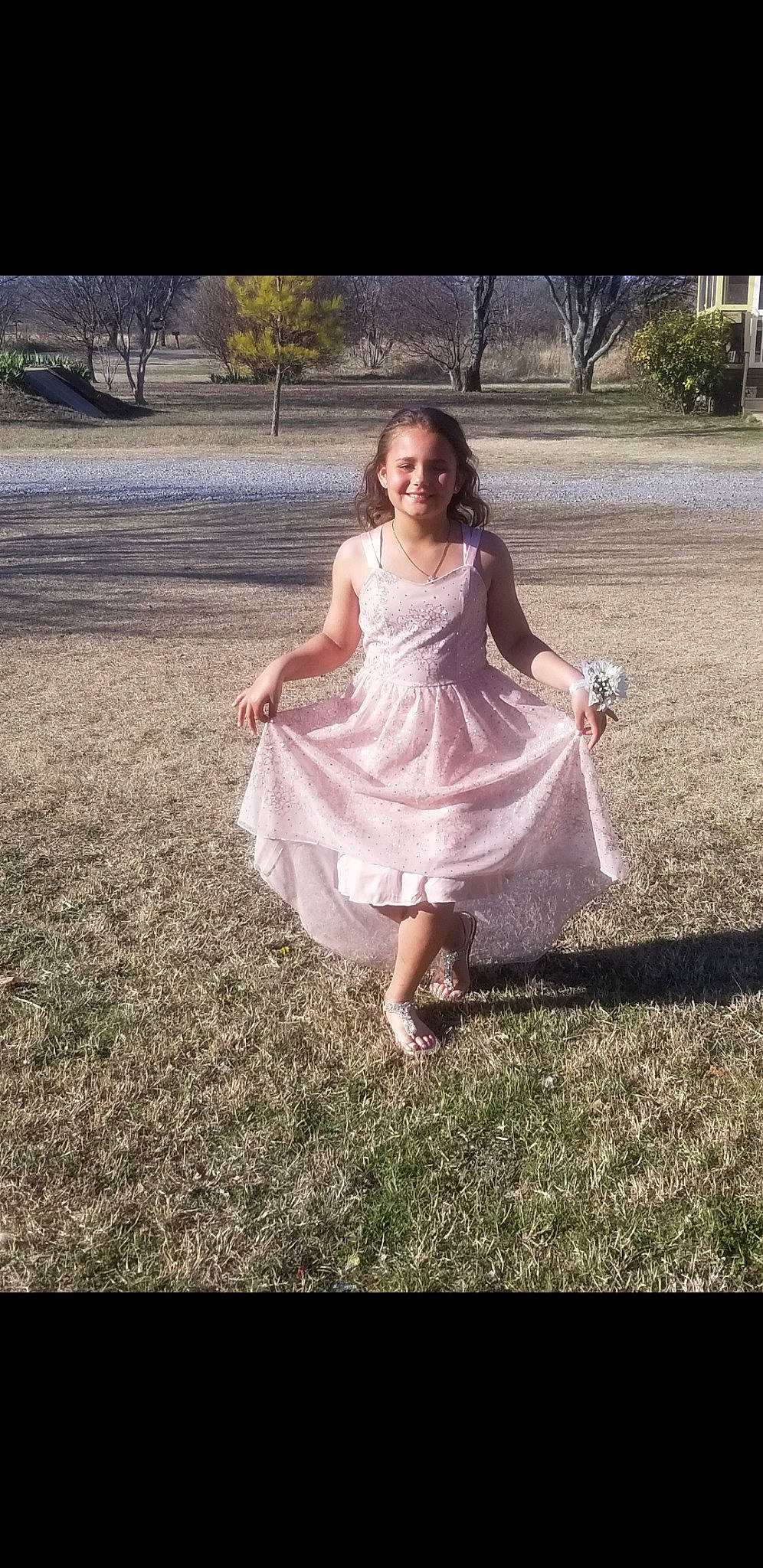 Carlee is registered to the contest to win money with this photo: beauty, bridal_clothing, bridal_party_dress, child, clothing, dress, fashion, footwear, formal_wear, gown, grass, joy, person, photograph, photography, pink, shoe, smile, summer, wedding