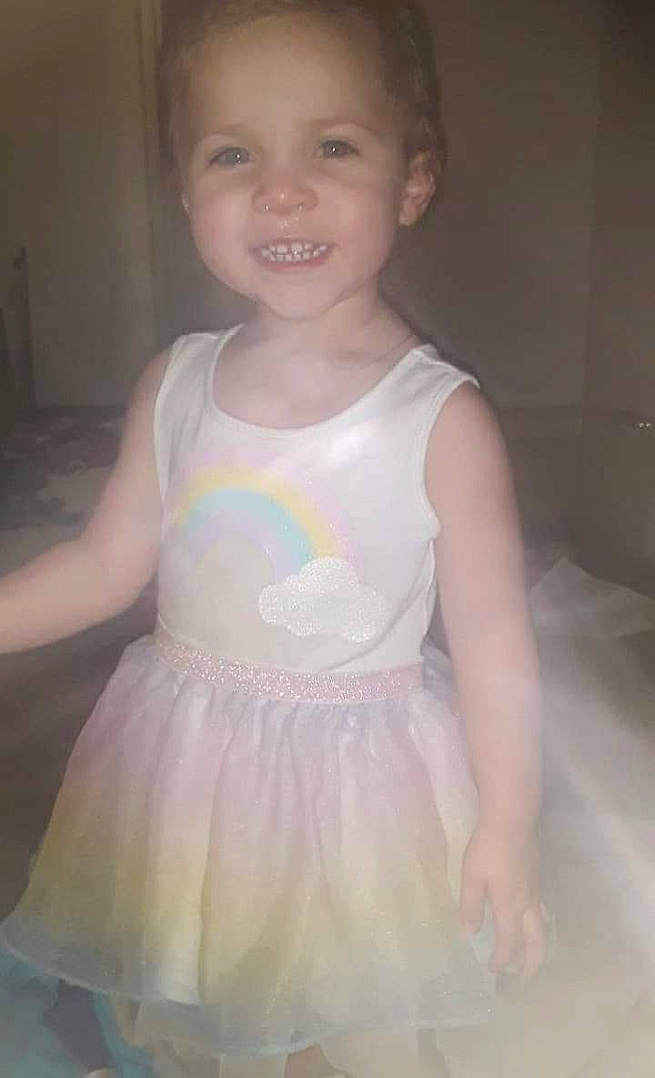 Edith is registered to the contest to win money with this photo: baby_toddler_clothing, cheek, child, day_dress, dress, eye, face, flash_photography, happy, iris, joy, neck, one_piece_garment, person, shoulder, skin, sleeve, smile, standing, t_shirt