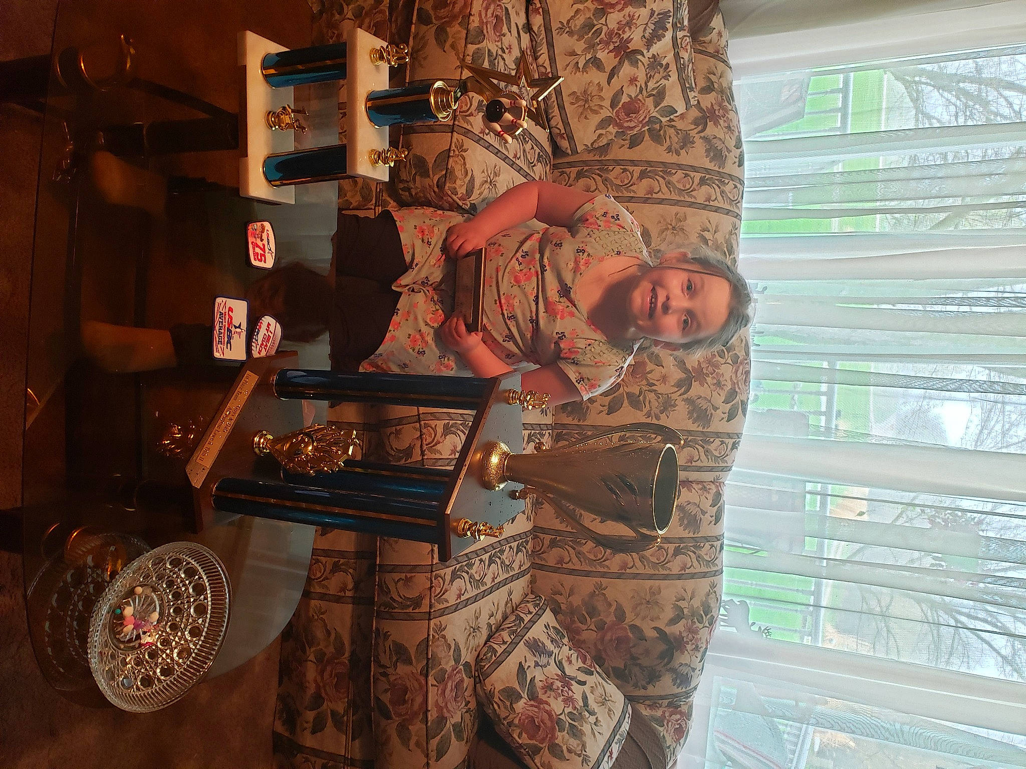 Cadence is registered to the contest to win money with this photo: art, brown, design, eyewear, flooring, font, history, joy, pattern, person, room, textile, tints_and_shades, tourist_attraction, tree, visual_arts, wall, wood