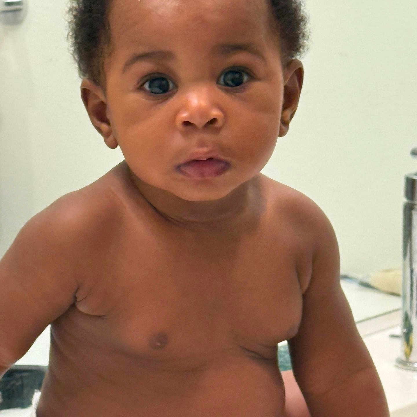 Ariana joined the competition — help win amazing prizes! baby, infant, child, diaper, bathroom, sink, faucet, skin, curly_hair, portrait, serious_expression, sitting, cute, young, indoors, closeup, person, toddler, face, eyes