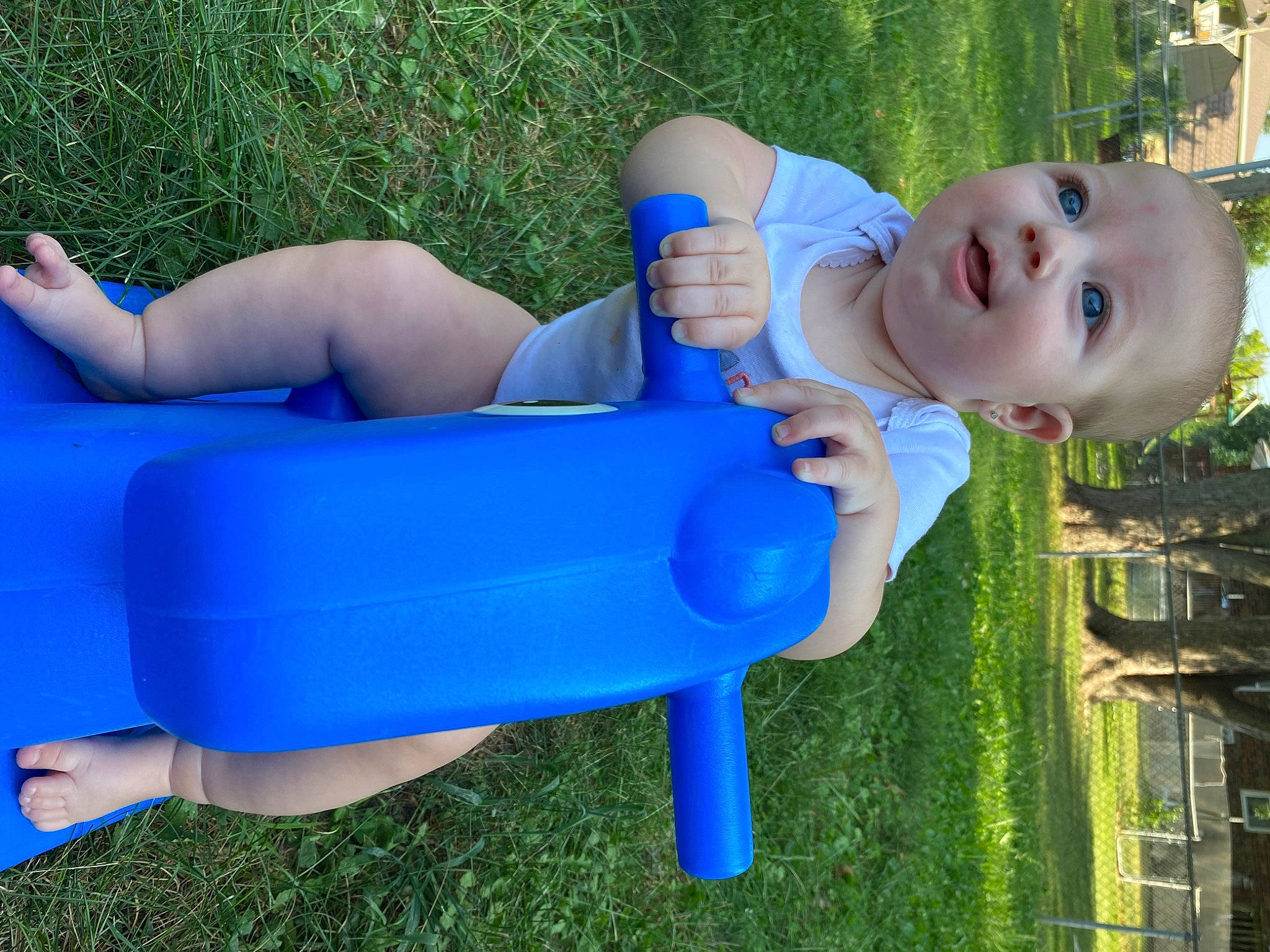 Saylor joined the competition — help win amazing prizes! azure, baby, baby_toddler_clothing, blue, electric_blue, fun, grass, green, happy, human_body, human_leg, leg, leisure, outdoor_furniture, people_in_nature, person, recreation, sitting, smile, thigh