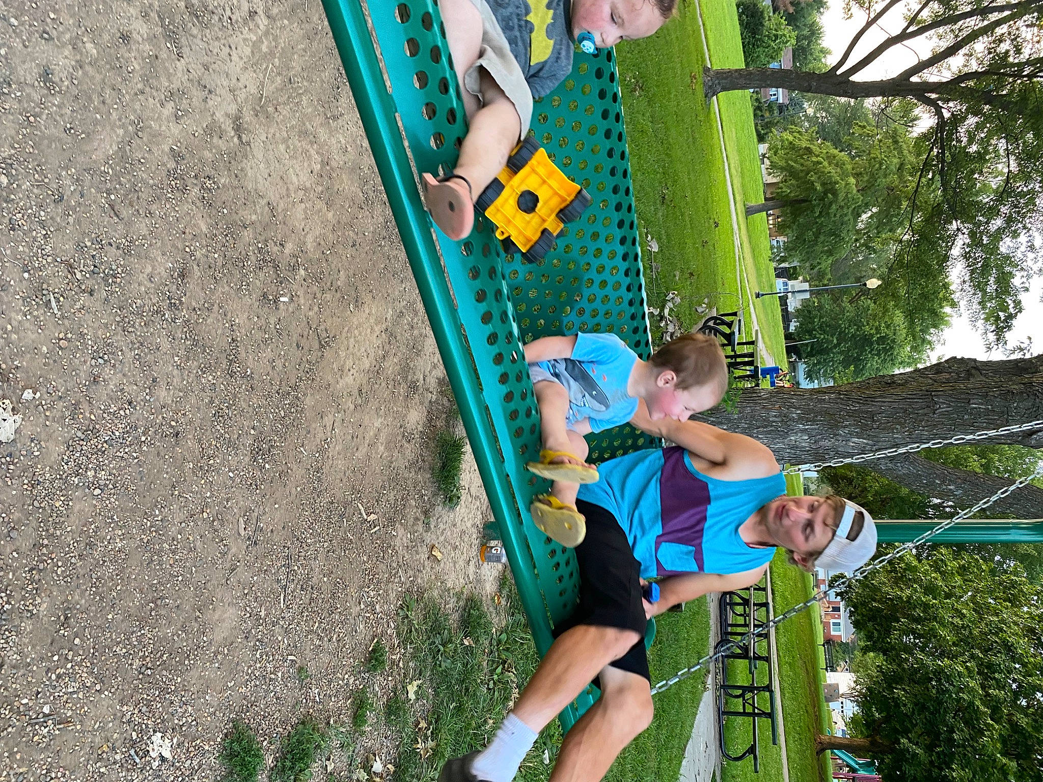 Saylor is registered to the contest to win money with this photo: child, chute, city, fun, grass, headwear, leisure, outdoor_play_equipment, people_in_nature, person, plant, play, playground, playground_slide, pole, recreation, shorts, soil, t_shirt, tree