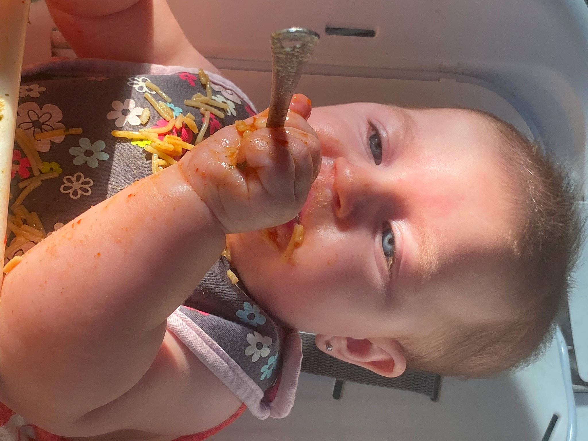 Saylor is registered to the contest to win money with this photo: cheek, chin, drinkware, ear, eyebrow, eyelash, finger, food, gesture, iris, jaw, lip, mouth, nail, neck, nose, person, skin, smile, toddler