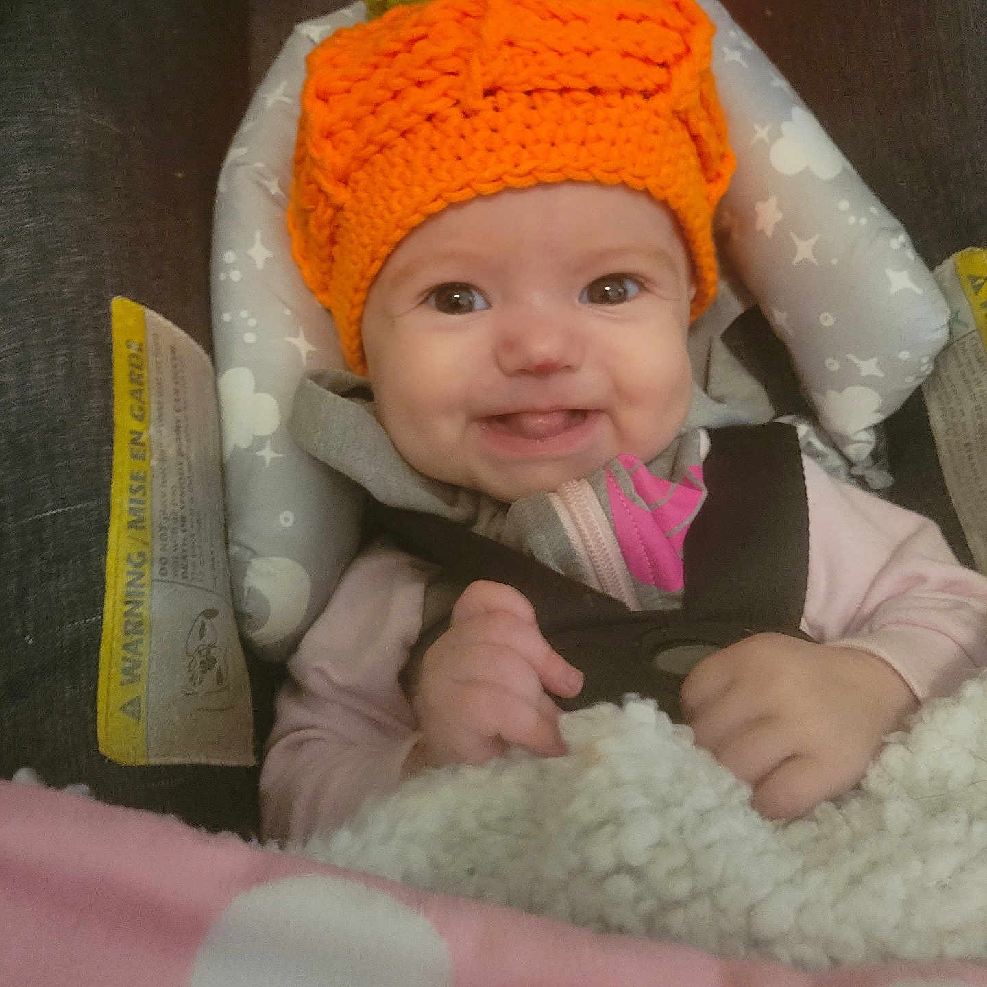 Brandy is registered to the contest to win money with this photo: baby, beanie, bodypart, bonnet, cap, car, clothing, couch, cushion, face, finger, furniture, hand, hat, head, homedecor, newborn, person, photography, portrait