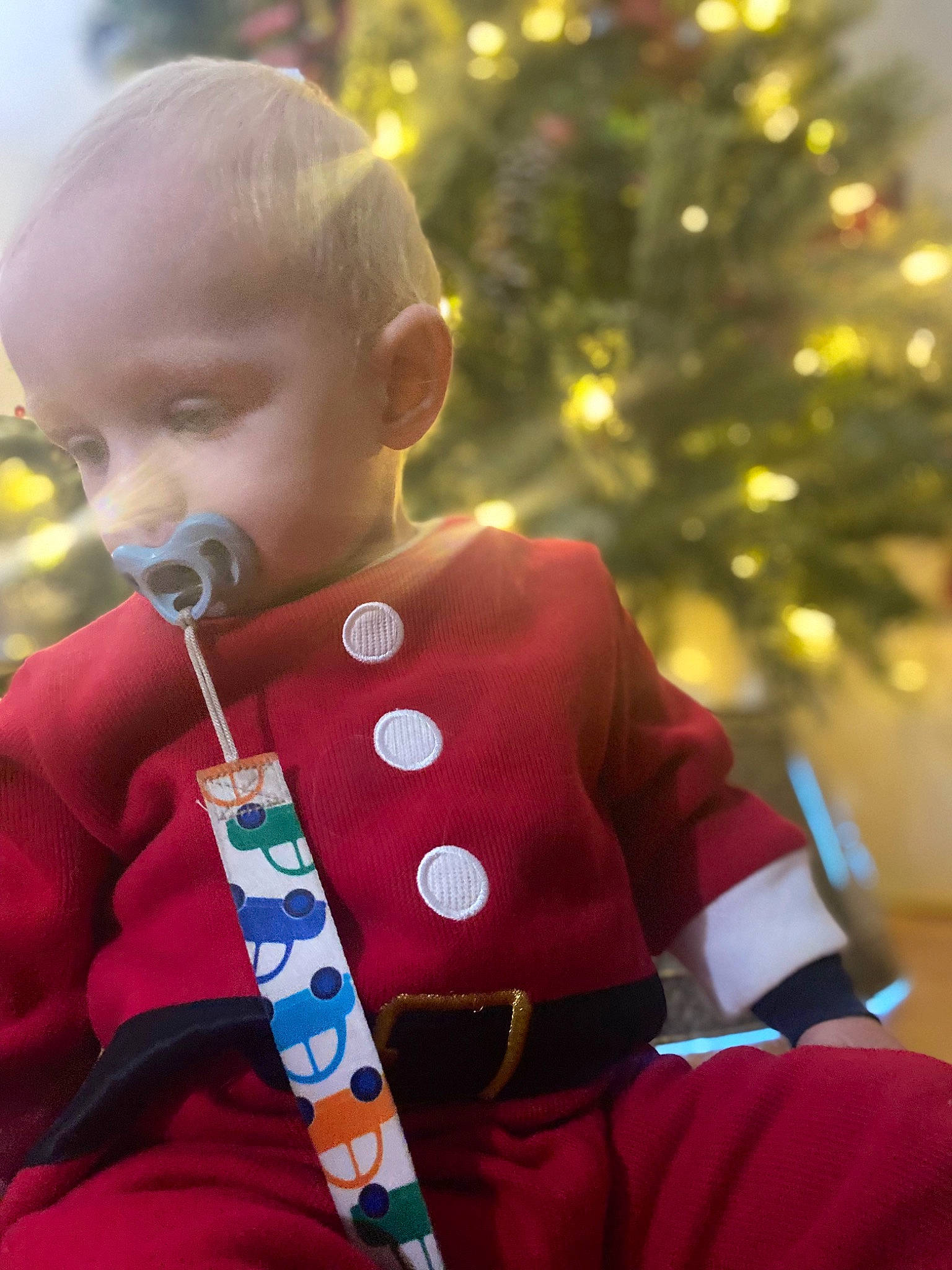 Eli joined the competition — help win amazing prizes! baby, baby_toddler_clothing, carmine, child, christmas, christmas_decoration, christmas_eve, christmas_ornament, christmas_tree, conifer, event, fun, happy, holiday, human_body, ornament, person, sitting, sleeve, toddler