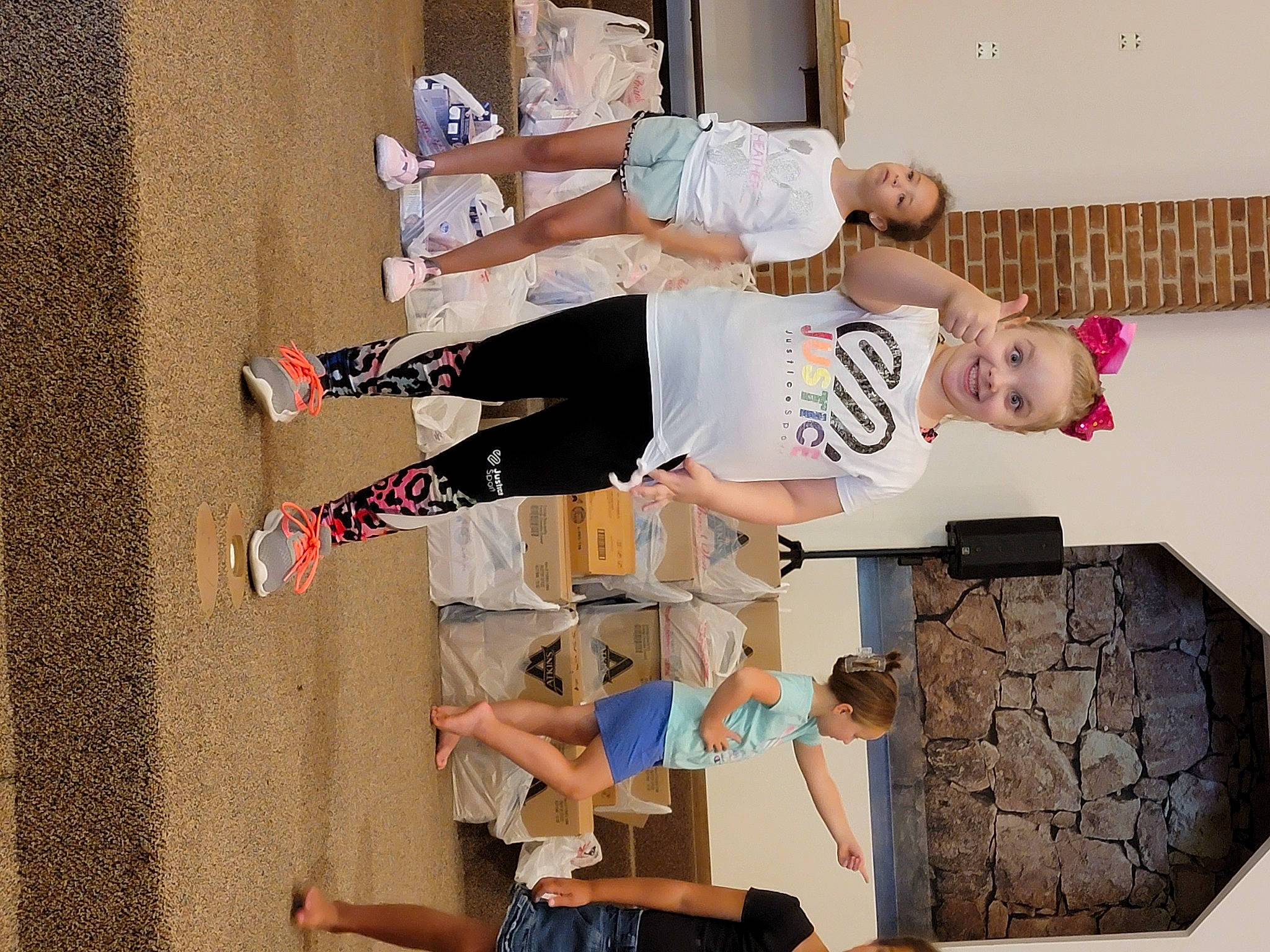 Mackenzie joined the competition — help win amazing prizes! art, balance, blurred, child, fun, joy, person, photograph, photography, room, shorts, t_shirt, thigh, visual_arts, walking_shoe, white, wood