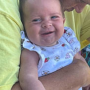 Ahvi Jane Bills joined the competition — help win amazing prizes! baby, smiling, adult, holding, white_outfit, flowers, strawberries, yellow_shirt, close_up, happy, child, person, skin, face, arm, affection, love, cute, portrait, outdoor