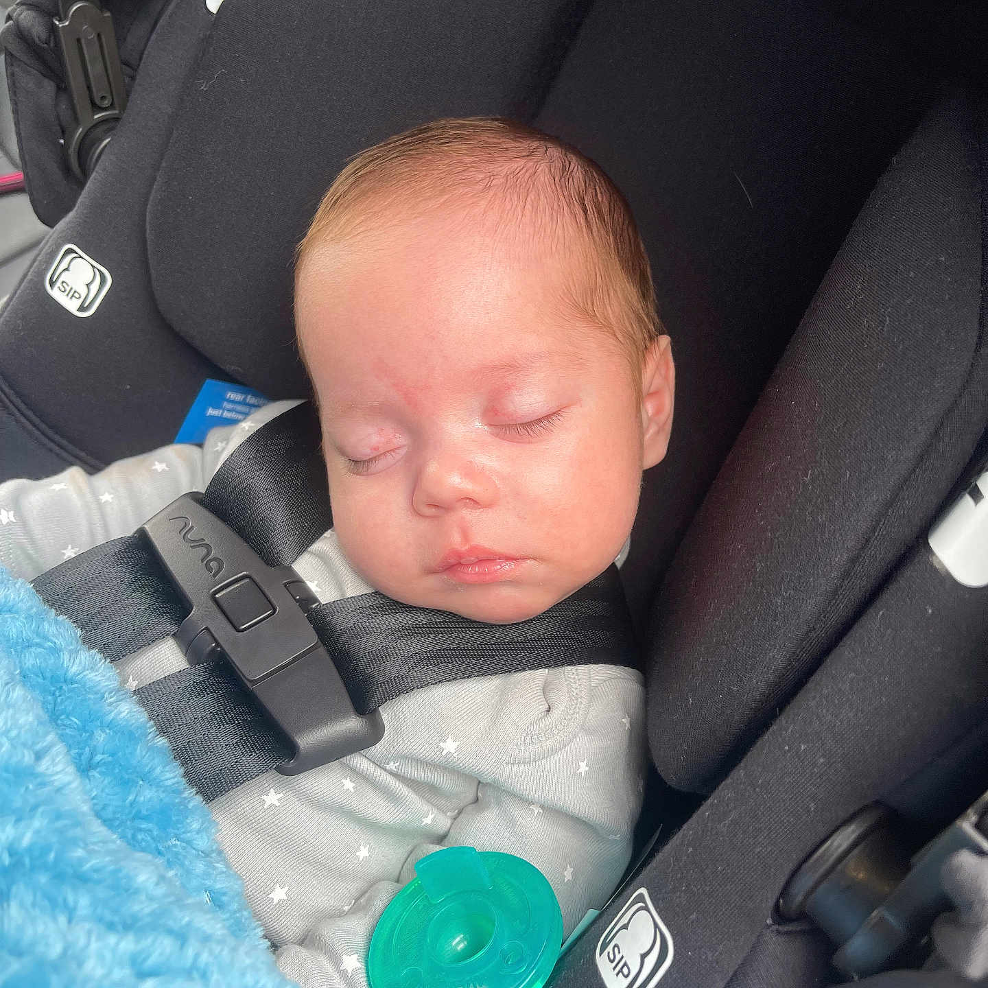 Luis is registered to the contest to win money with this photo: baby, car, car_interior, carseat, creditcard, cushion, face, furniture, gun, head, homedecor, newborn, person, photography, portrait, sleeping, text, transportation, vehicle, weapon