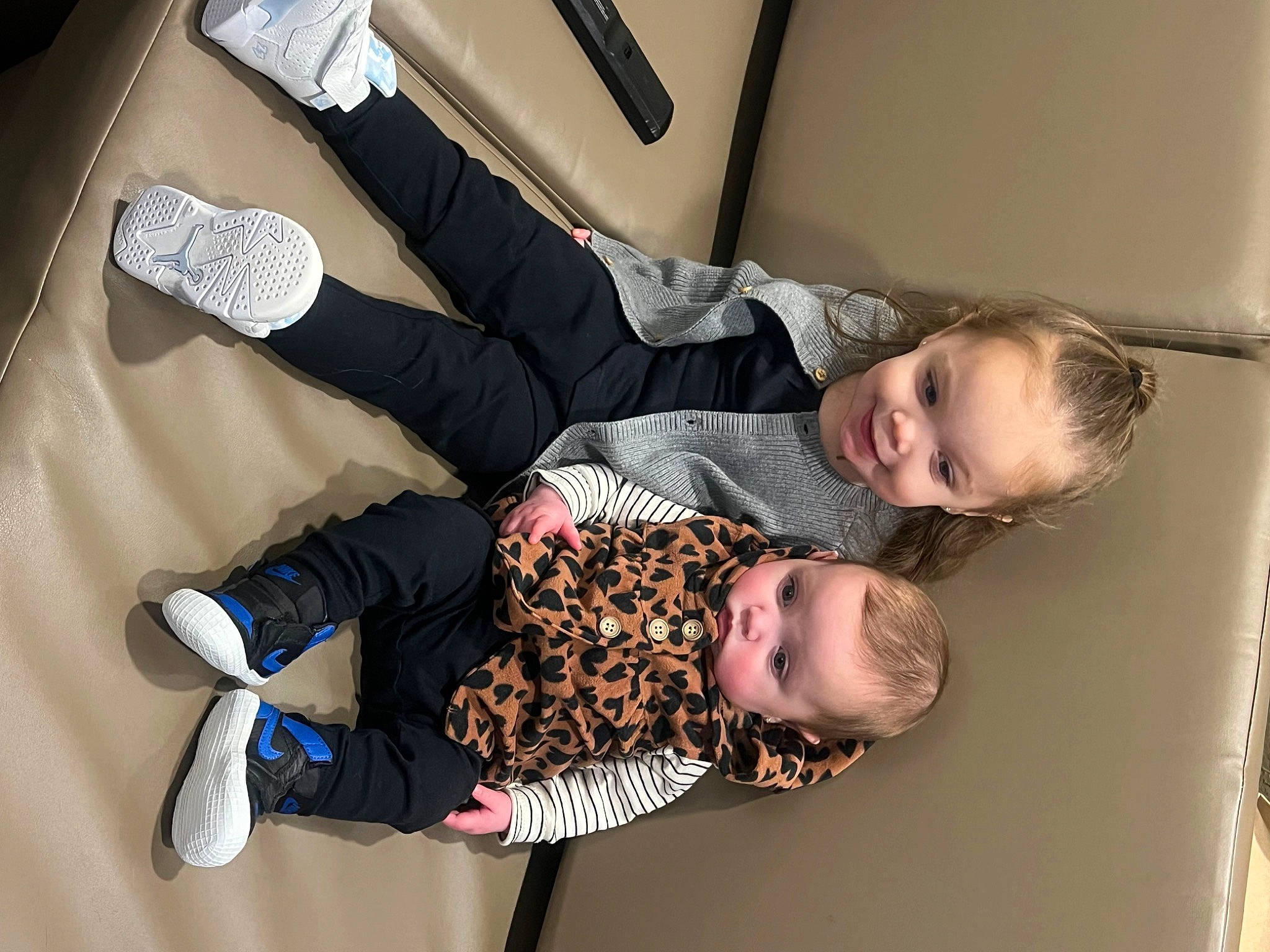 Elianna is registered to the contest to win money with this photo: baby, baby_products, baby_toddler_clothing, child, comfort, fun, happy, joy, knee, person, room, sitting, smile, sock, toddler