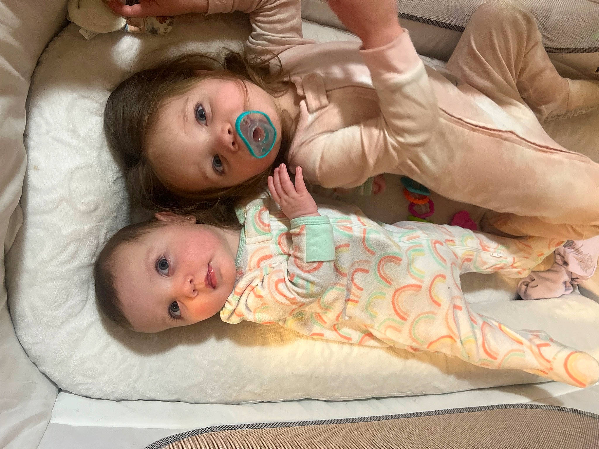 Elianna is registered to the contest to win money with this photo: abdomen, baby, child, comfort, couch, doll, eye, eyelash, face, flooring, fur, gesture, happy, linens, person, room, sitting, skin, toddler, toy