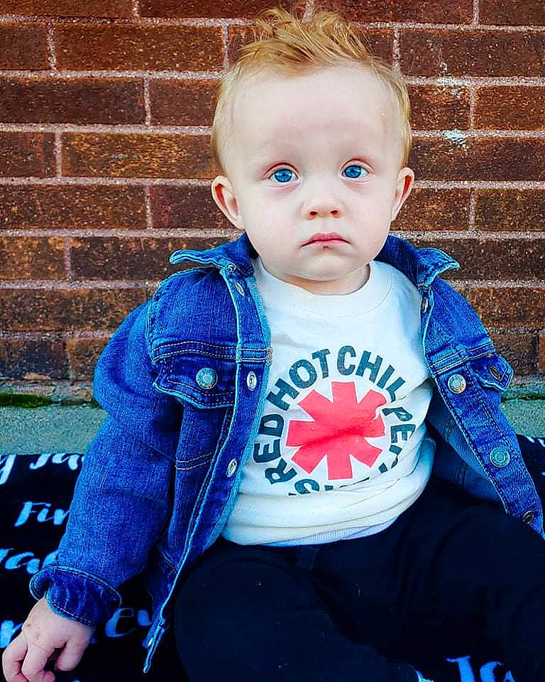 Finnley joined the competition — help win amazing prizes! azure, baby, baby_toddler_clothing, blue, brick, brickwork, cheek, clothing, cool, electric_blue, face, hair, happy, iris, neck, pattern, person, product, skin, sleeve