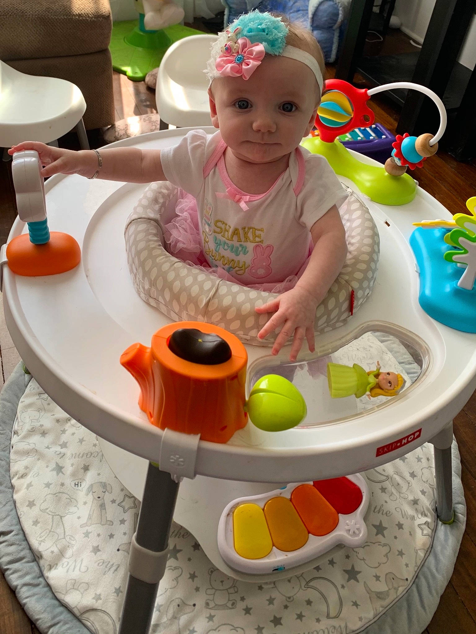 Lillian is registered to the contest to win money with this photo: baby, baby_toddler_clothing, chair, child, dishware, event, fun, green, happy, leisure, party_supply, person, plate, play, serveware, smile, table, tableware, toddler, toy