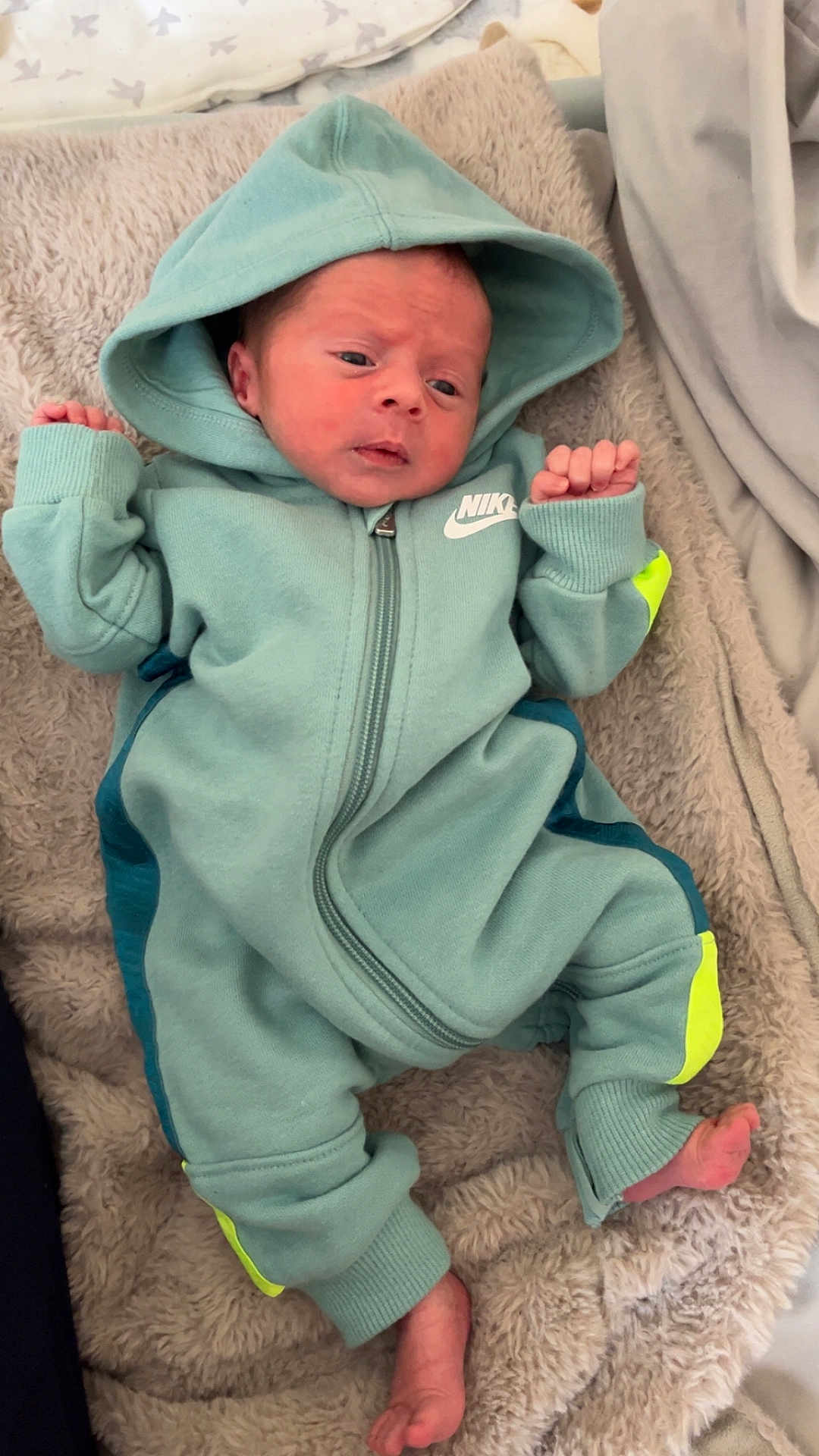 Brodie-Lee joined the competition — help win amazing prizes! baby, infant, hoodie, nike, clothing, blanket, feet, hands, face, person, child, sleepwear, cozy, soft, fabric, cute, newborn, lying_down, indoor, portrait