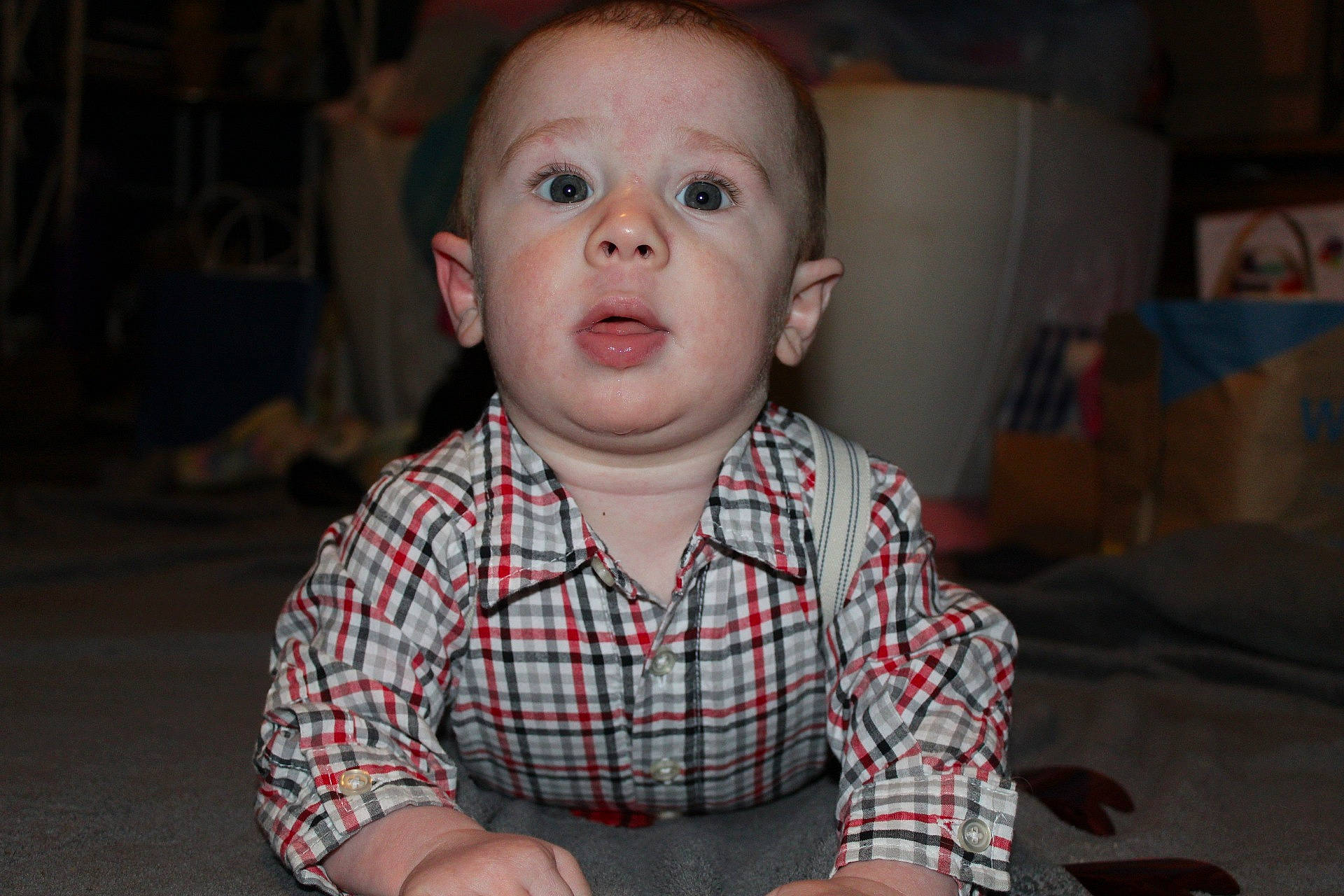 Kamron is registered to the contest to win money with this photo: baby, baby_toddler_clothing, cheek, child, event, flash_photography, fun, happy, head, laugh, nose, pattern, person, plaid, portrait_photography, room, sitting, sleeve, surprise, t_shirt