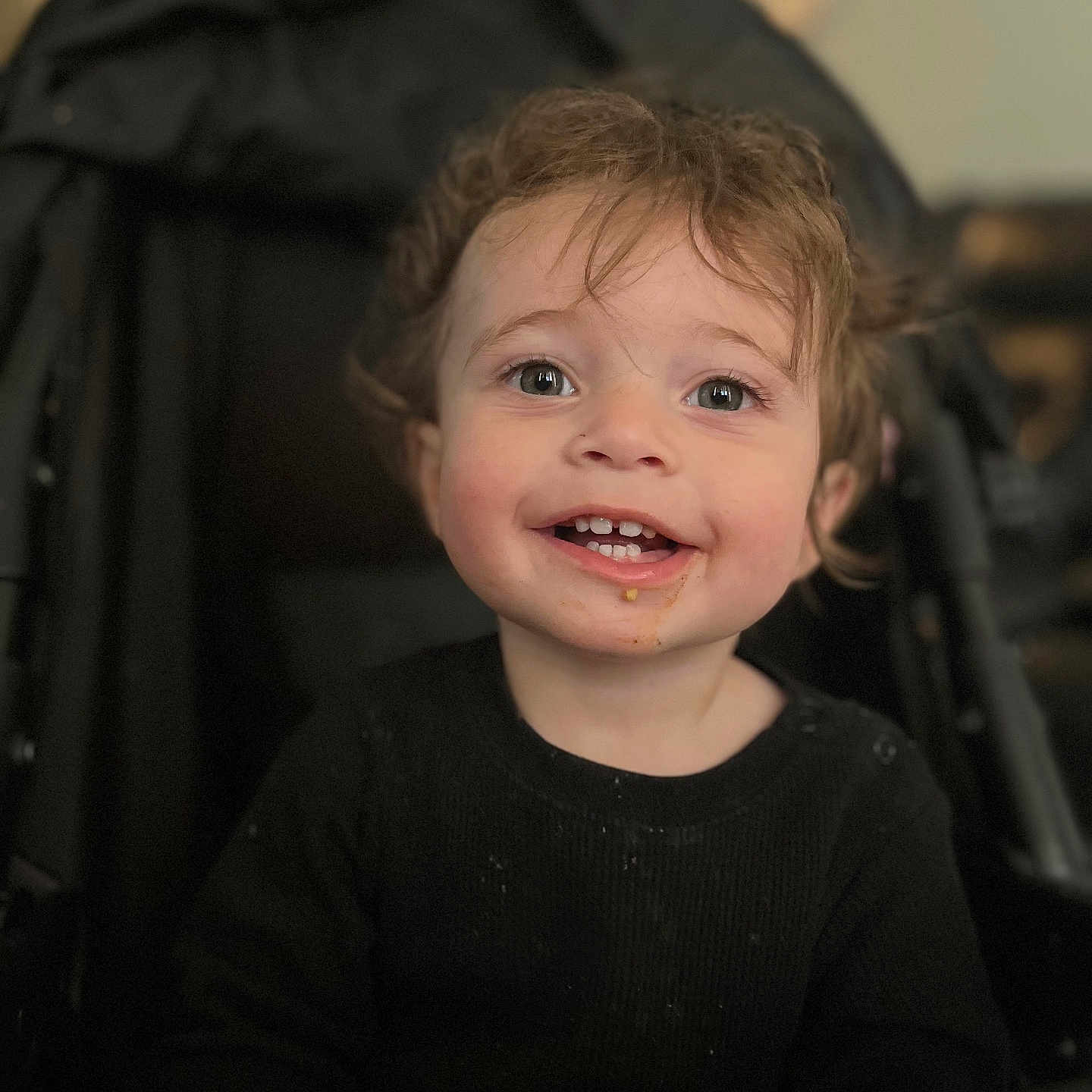 Thiago is registered to the contest to win money with this photo: accessories, baby, bodypart, clothing, face, finger, hand, happy, head, laughing, mouth, neck, person, photography, portrait, smile, strap, stroller, t_shirt, teeth