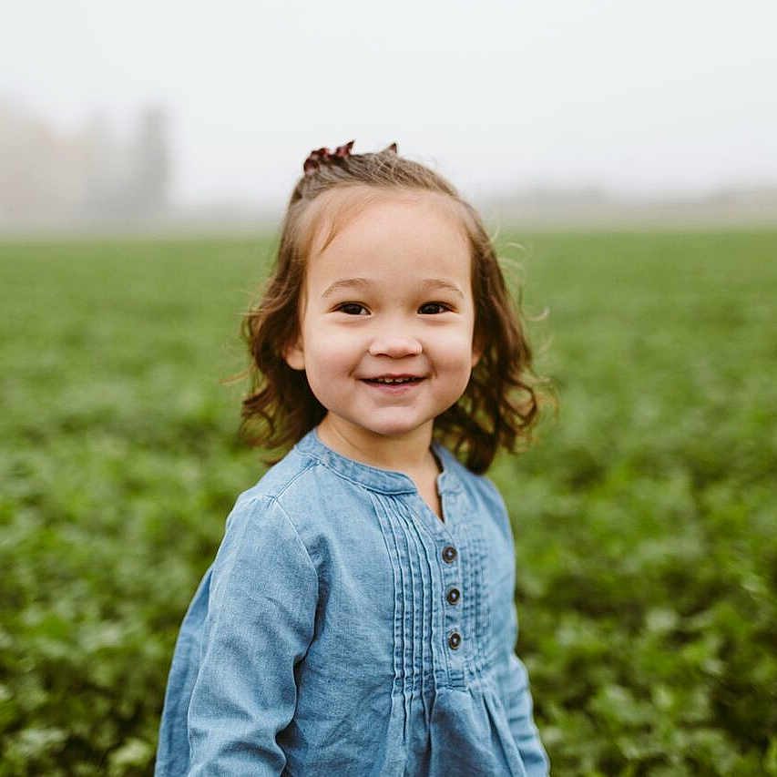 Olive is registered to the contest to win money with this photo: child, crop, farm, field, fun, grass, grass_family, grassland, happy, joy, meadow, people, people_in_nature, person, photograph, photography, plant, portrait, portrait_photography, sky