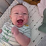 Elijah is registered to the contest to win money with this photo: baby, babylaughing, bed, bodypart, cradle, crib, face, finger, furniture, hand, happy, head, infantbed, laughing, newborn, person, photography, portrait