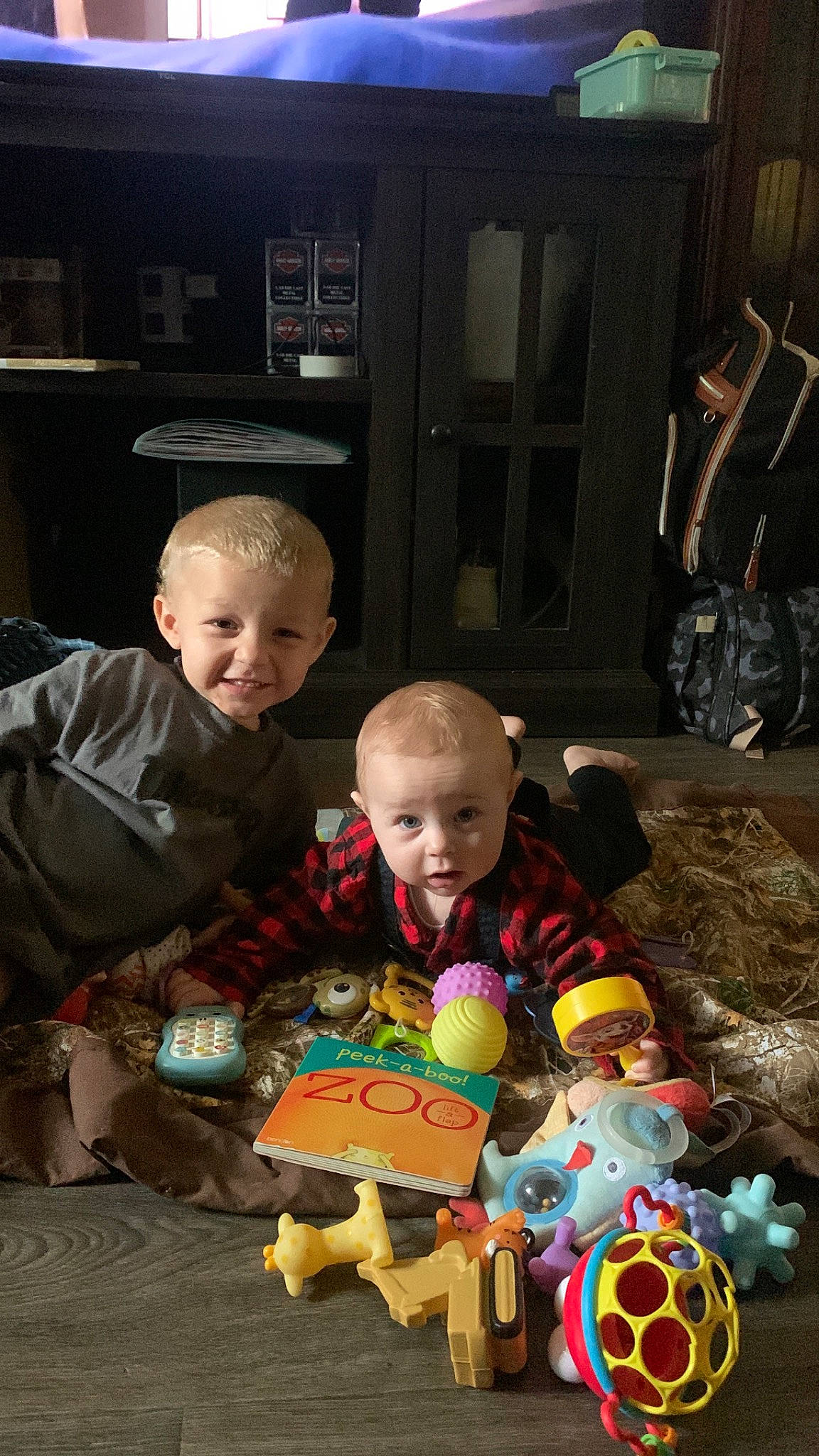 Asher is registered to the contest to win money with this photo: baby, child, event, flooring, football, fun, happy, head, holiday, joy, leisure, party, person, play, room, sharing, sitting, smile, t_shirt, toddler