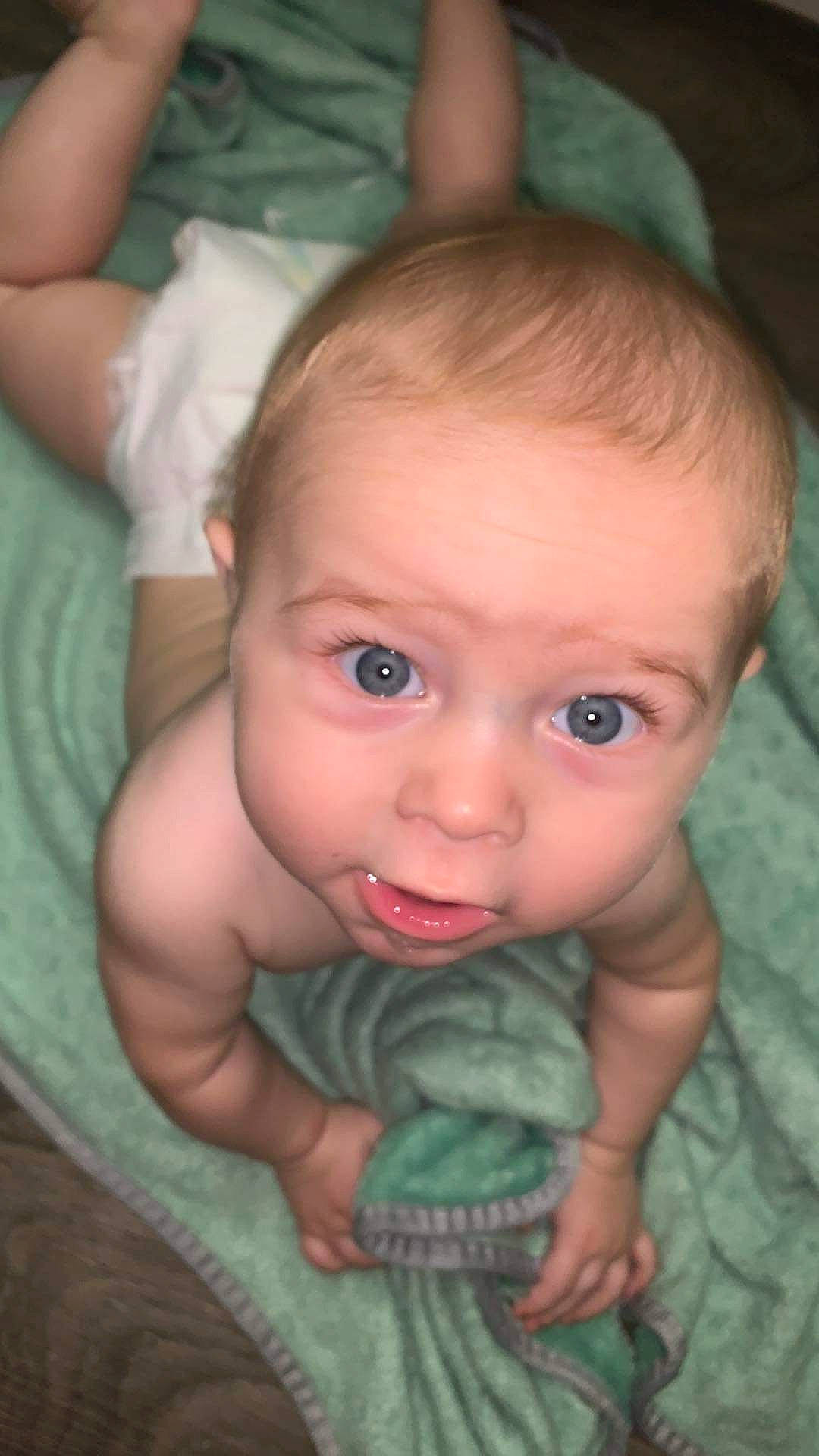 Emmett is registered to the contest to win money with this photo: baby, baby_toddler_clothing, cheek, chin, ear, eye, eyebrow, eyelash, finger, flash_photography, forehead, gesture, hand, head, iris, lip, mouth, nose, organ, person