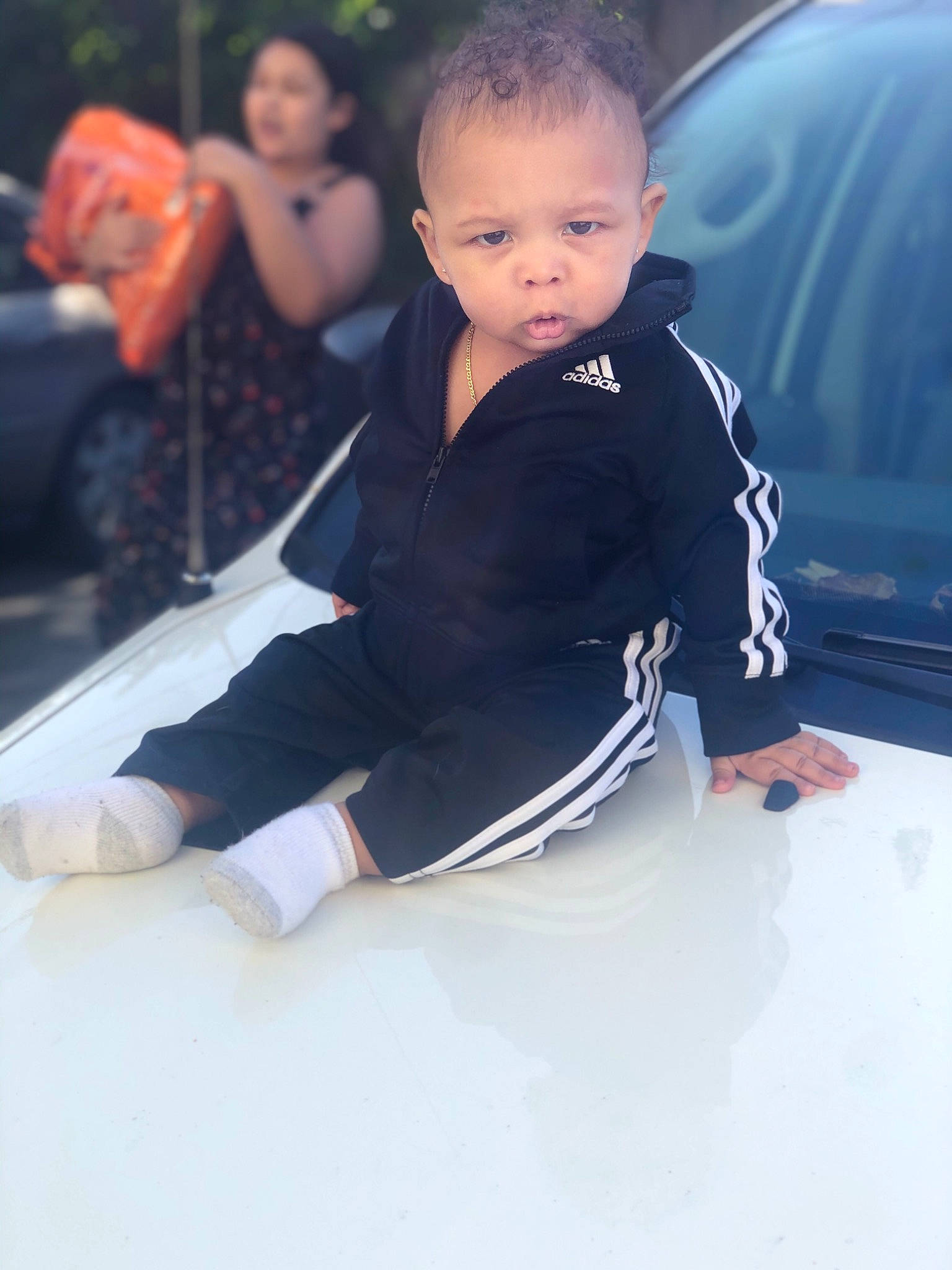 Jakai is registered to the contest to win money with this photo: baby, black_hair, blurred, cheek, child, leg, person, photography, sitting, skin, smile, toddler, vacation