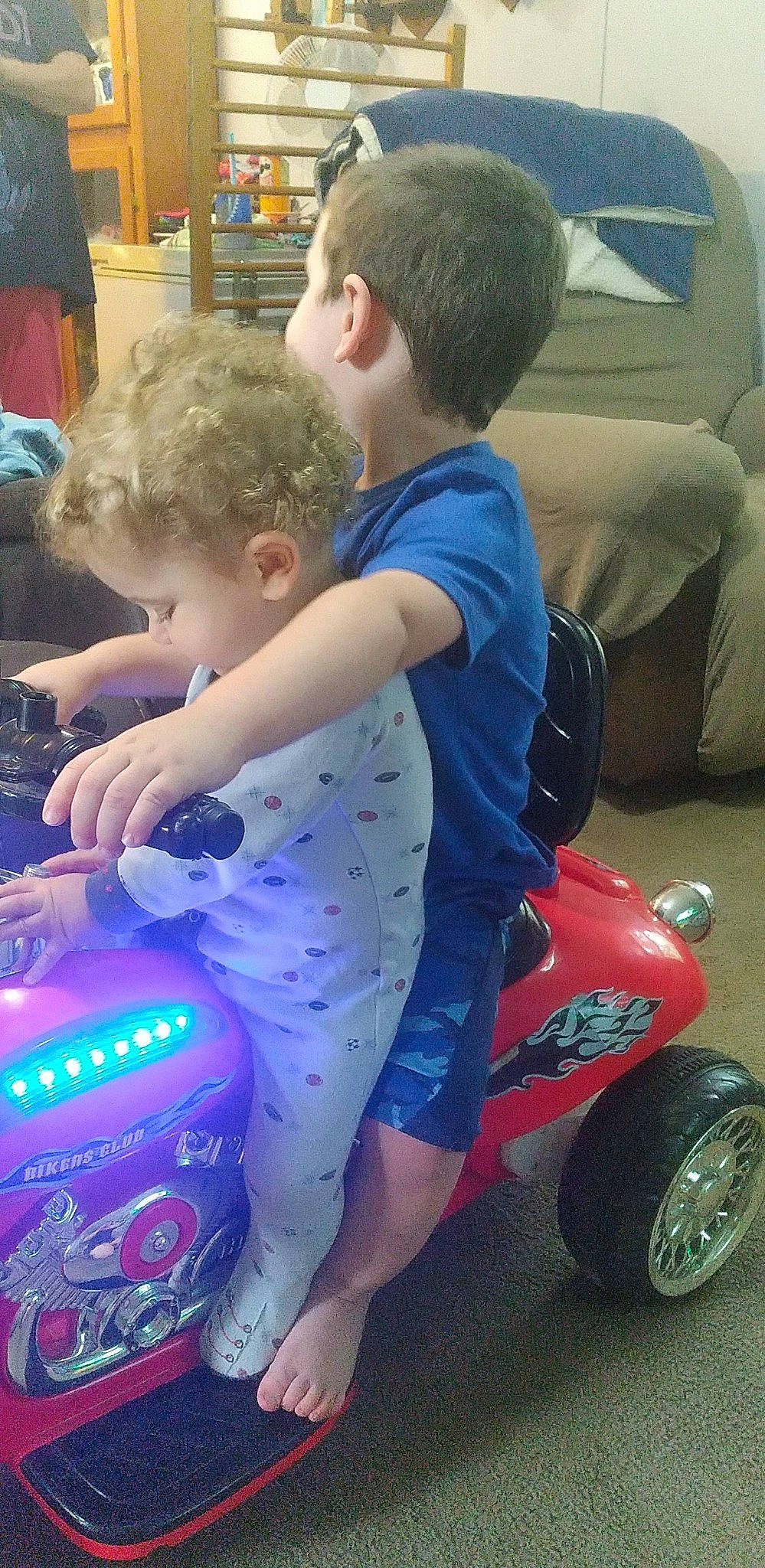 Jericho joined the competition — help win amazing prizes! automotive_design, automotive_tire, blue, bumper, child, electric_blue, fun, grass, leisure, person, play, product, riding_toy, shorts, sitting, t_shirt, tire, toddler, vehicle, water_bottle