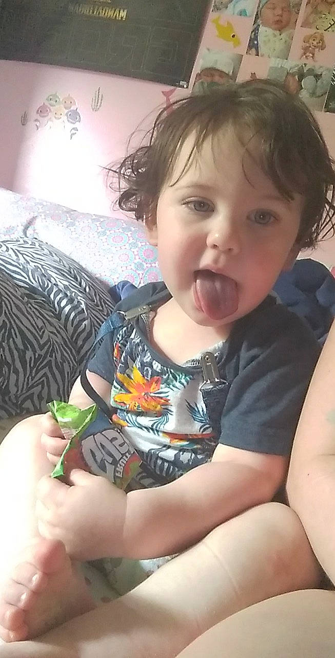 Elijah is registered to the contest to win money with this photo: arm, baby_toddler_clothing, cheek, chin, eyelash, hair, hairstyle, hand, happy, head, headwear, human_body, iris, leg, lip, mouth, neck, nose, person, skin