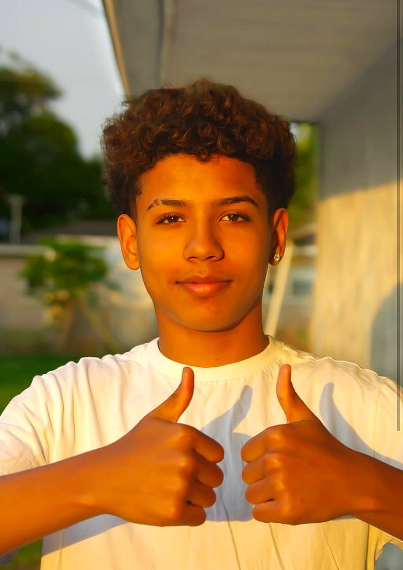 Marcell joined the competition — help win amazing prizes! afro, barechested, chest, child, chin, forehead, fun, gesture, grass, happy, joy, leisure, muscle, person, sign_language, smile, t_shirt, thumb, tree, vacation