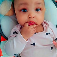 Diamond joined the competition — help win amazing prizes! baby, infant, child, face, hand, clothing, onesie, hair_clips, colorful, blanket, pattern, heart_pattern, soft, cute, indoors, portrait, lying_down, expression, curious, skin