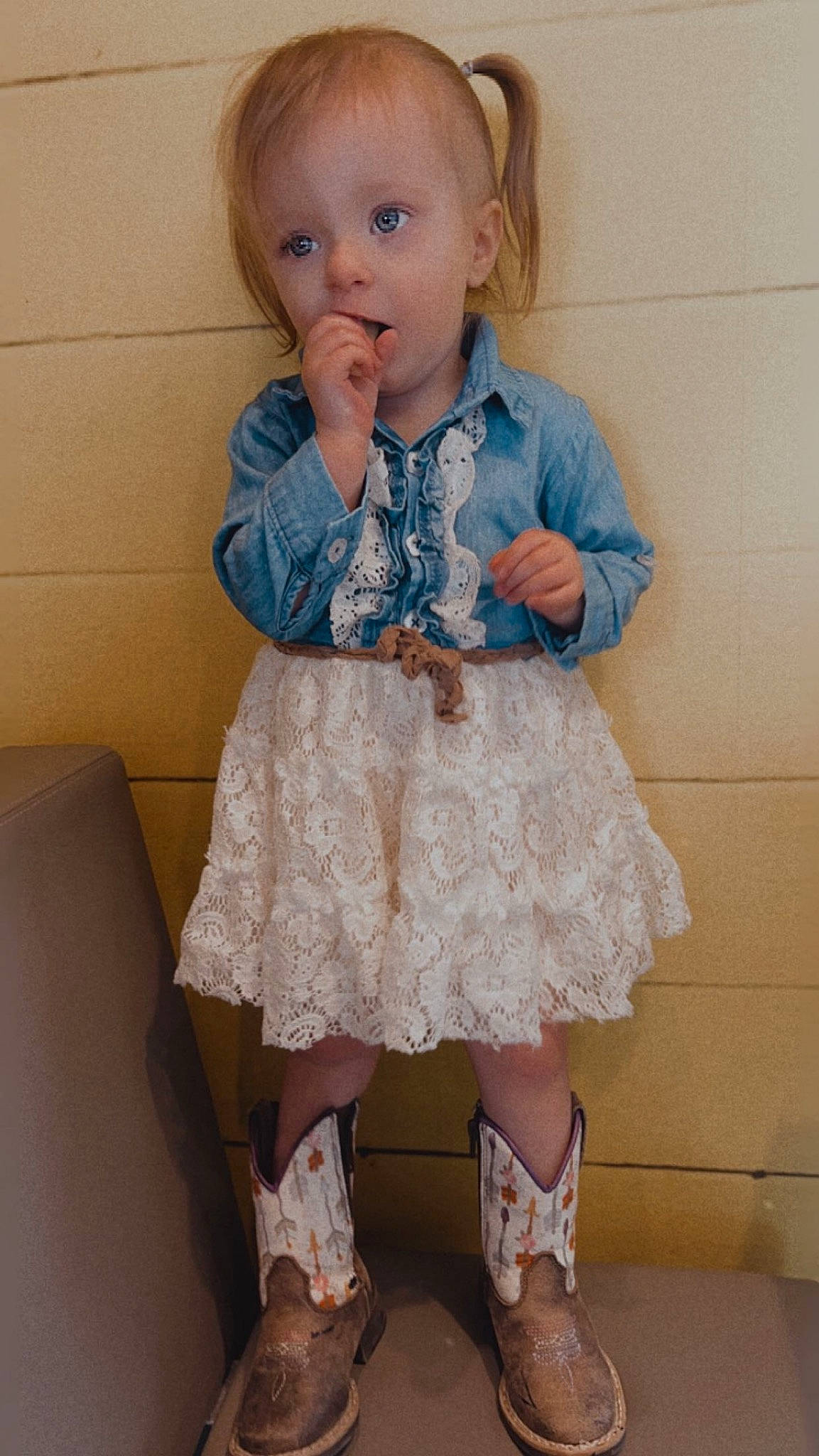 Dakota is registered to the contest to win money with this photo: baby, baby_toddler_clothing, blond, child, clothing, day_dress, dress, footwear, human_leg, iris, knee, leg, one_piece_garment, pattern, person, pink, skin, sleeve, sock, surprise