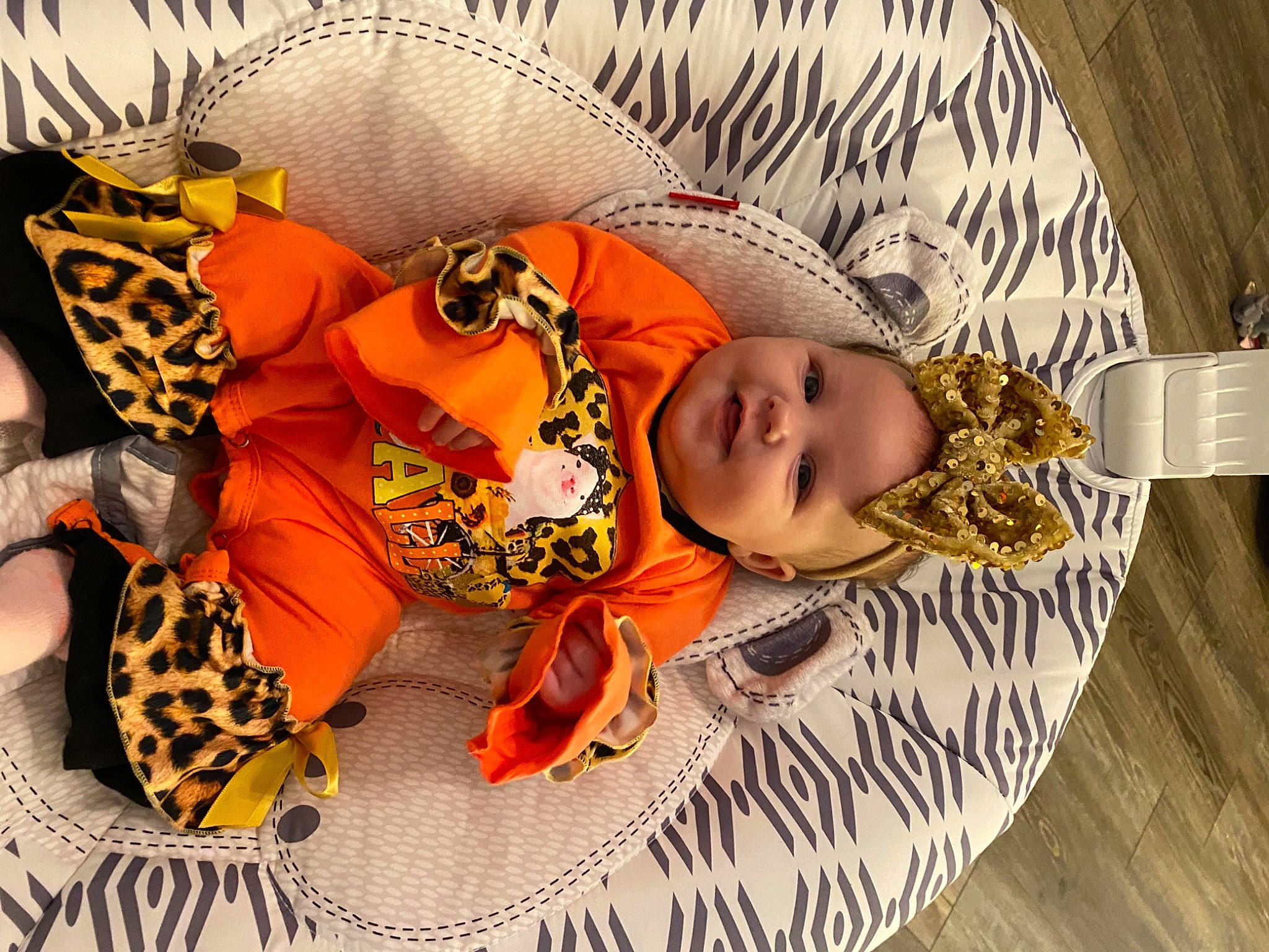 Raelynn is registered to the contest to win money with this photo: art, baby, baby_products, baby_sleeping, baby_toddler_clothing, brown, calabaza, child, comfort, fashion_accessory, font, happy, hat, headgear, linens, orange, pattern, person, terrestrial_animal, textile