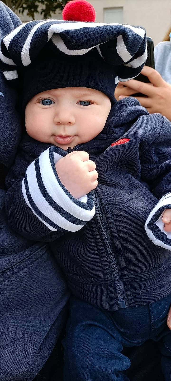Evan participe au concours pour gagner de l'argent avec cette photo : baby, baby_carriage, baby_products, baby_toddler_clothing, cap, cheek, child, cool, electric_blue, facial_expression, finger, flash_photography, gesture, hat, headgear, headwear, person, skin, sleeve, thumb