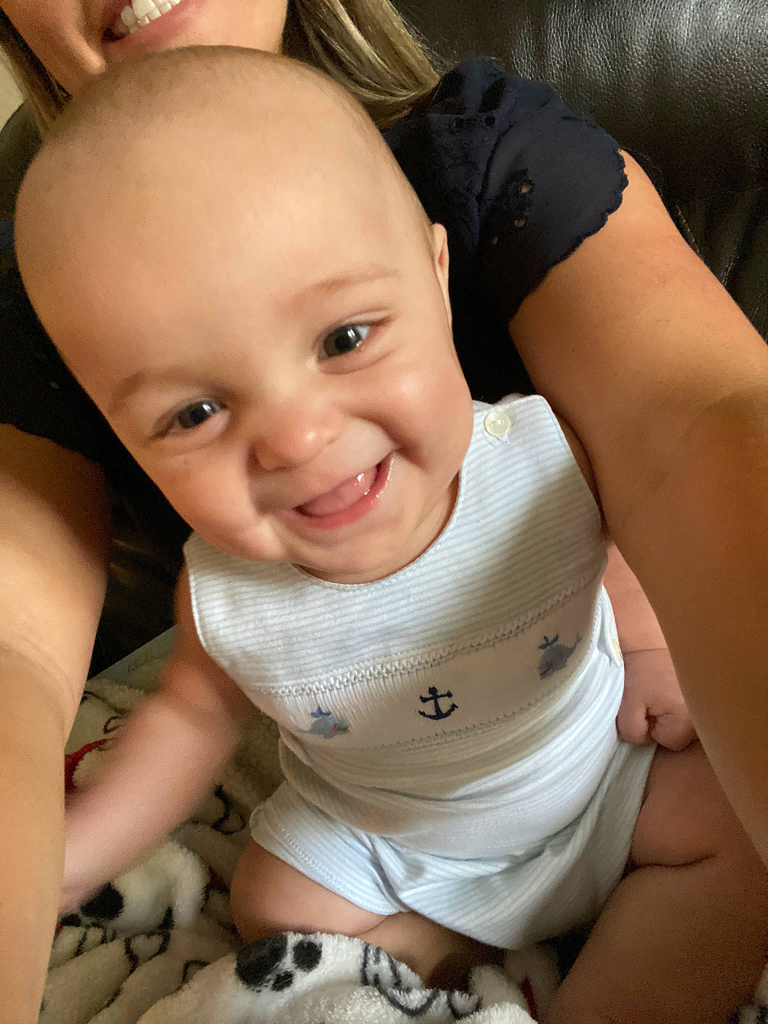 Archer is registered to the contest to win money with this photo: baby, baby_toddler_clothing, black, cheek, chin, eye, eyebrow, flash_photography, happy, head, human_body, joint, joy, lip, mouth, muscle, nose, person, skin, sleeve