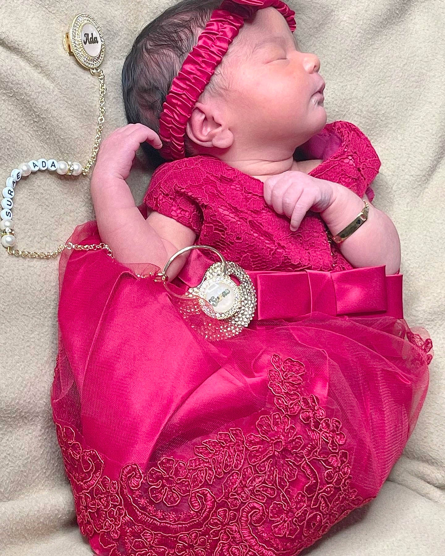 Surae is registered to the contest to win money with this photo: baby, baby_toddler_clothing, cap, cheek, comfort, dress, face, fashion, lip, magenta, neck, outerwear, pattern, person, pink, purple, red, skin, sleeve, textile