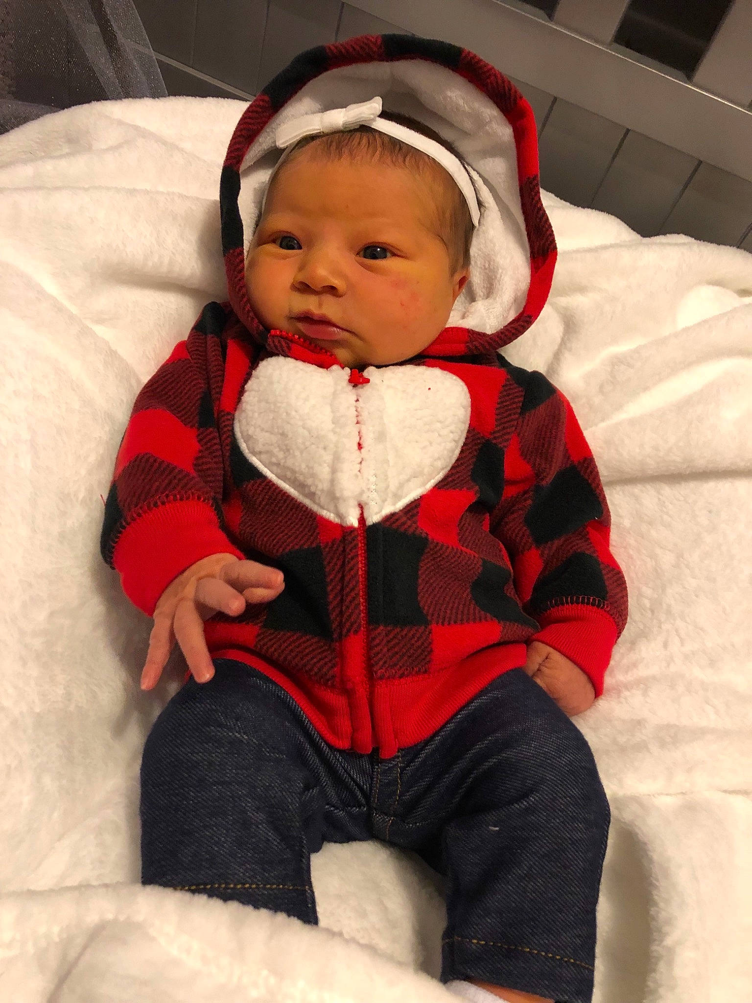 Katie is registered to the contest to win money with this photo: child, christmas, headgear, infant, lap, outerwear, person, product, red, skin, smile, textile, toddler