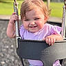 Allison joined the competition — help win amazing prizes! child, clothing, daylight, face, fun, grass, hair, hand, happy, leisure, metal_chain, outdoor, park, plastic_swing, playground, polka_dot_pants, purple_shirt, smile, swing, toddler