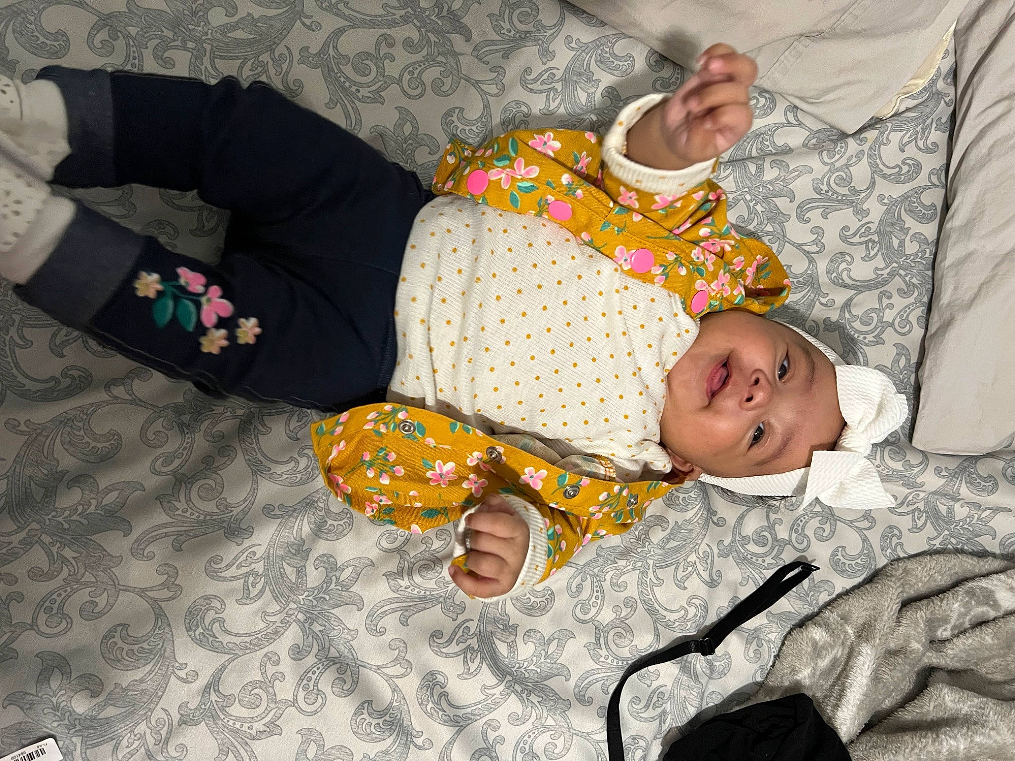 Alyanna is registered to the contest to win money with this photo: arm, baby, baby_products, baby_sleeping, baby_toddler_clothing, child, comfort, finger, hand, head, headwear, human_body, lap, leg, linens, pattern, person, room, sitting, sleeve