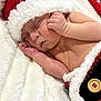Samuel joined the competition — help win amazing prizes! baby, newborn, infant, sleeping, santa_hat, hat, blanket, bedding, cozy, cute, peaceful, hand, arm, rosy_cheeks, knit, button, close_up, portrait, soft_texture, holiday