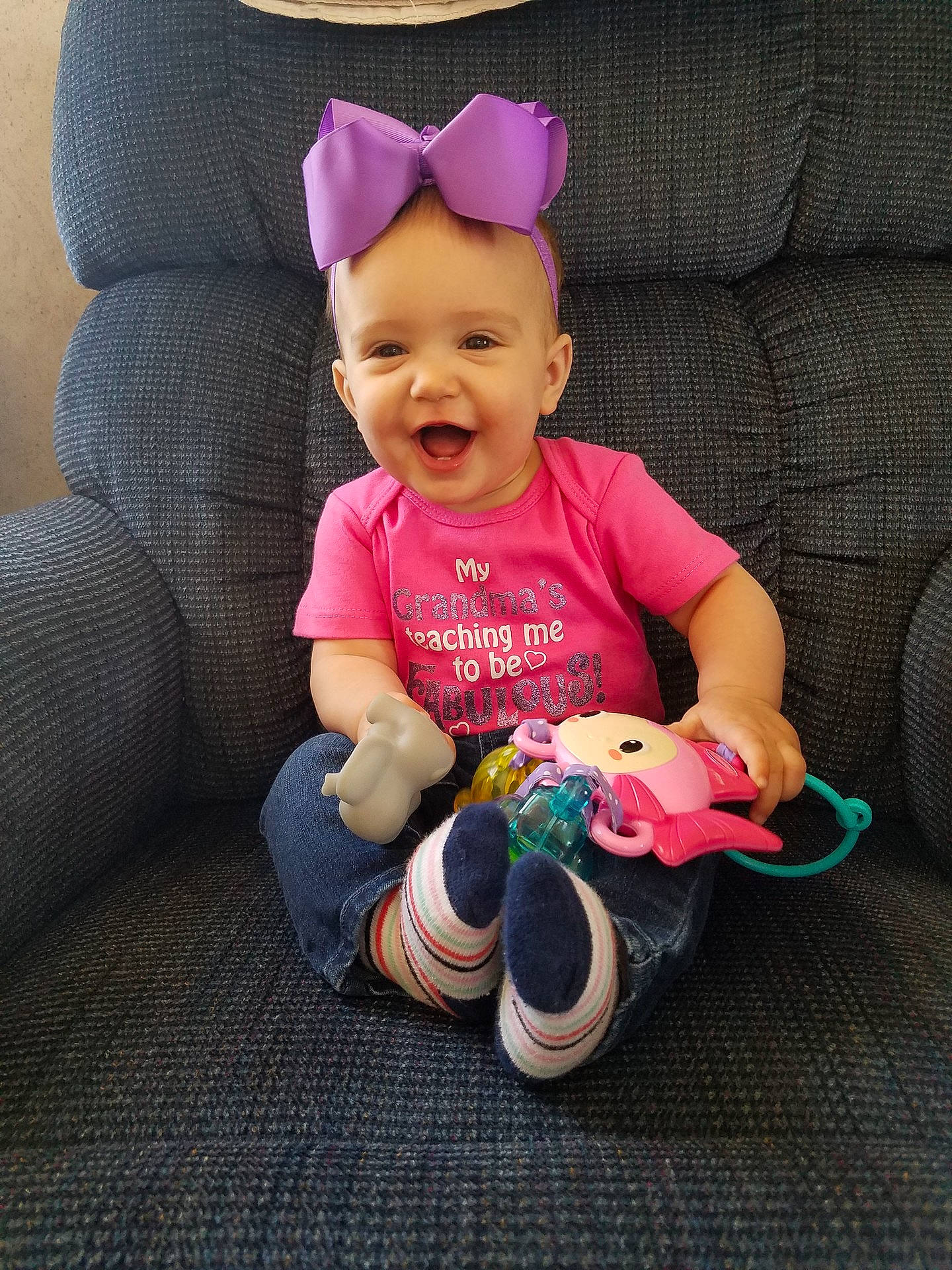 Blakelynn is registered to the contest to win money with this photo: child, headgear, infant, magenta, person, pink, play, product, purple, skin, smile, toddler, toy
